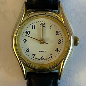 Women’s small face black leather and gold colored elegant wristwatch ⌚️